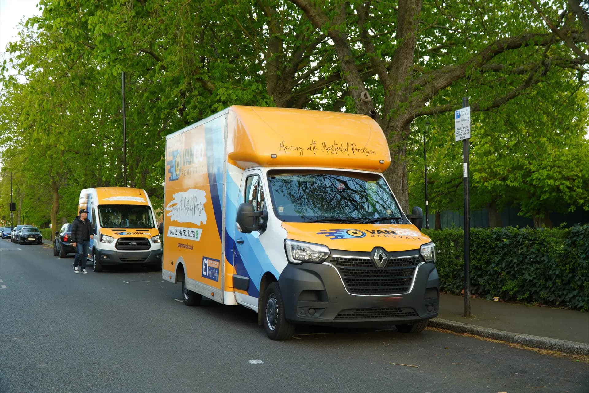 VanGo Removals team carrying boxes outside a Hammersmith W6 mansion block